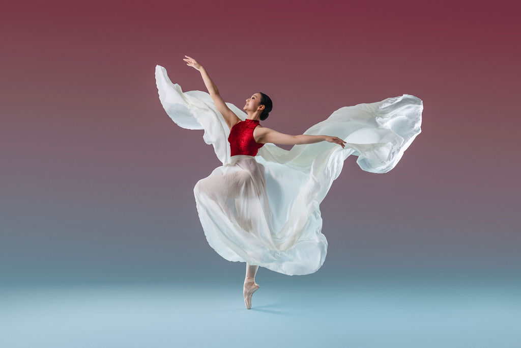Dancer in dramatic flowing fabric
